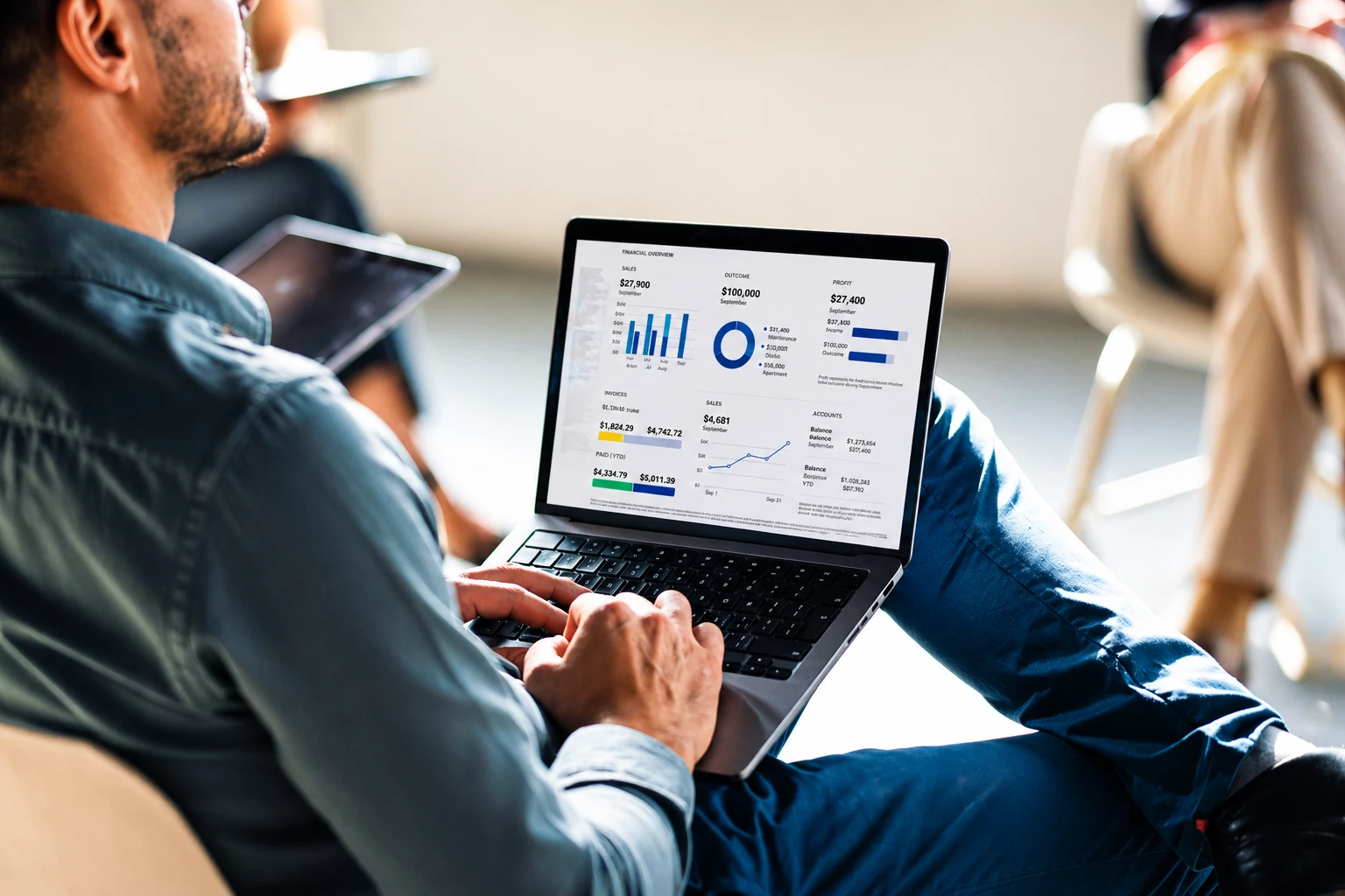 Business professional reviewing financial dashboard on laptop using ERP software