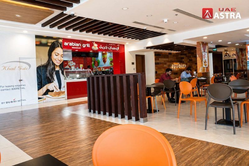 Food court seating area with dining tables inside community centre