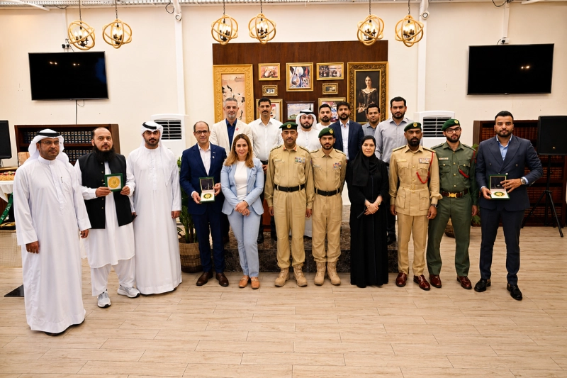 Group photo of Dubai Police officers and officials at Naif Police Station Dubai