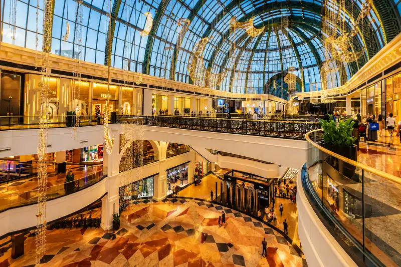Luxury shopping interior inside Mall of the Emirates Dubai with fashion stores and modern architecture