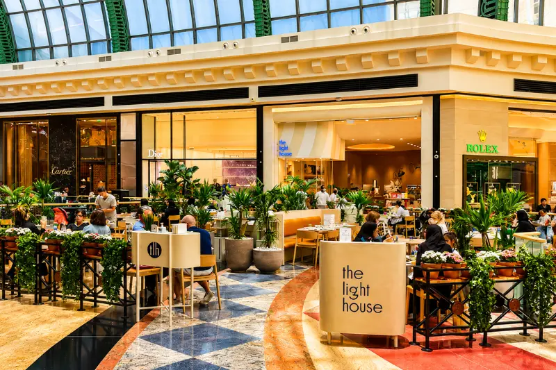 Outdoor dining and luxury shopping area inside Mall of the Emirates Dubai