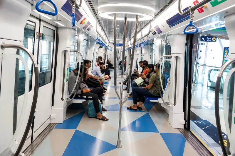 Passengers inside a Dubai Metro train near DAFZA Station