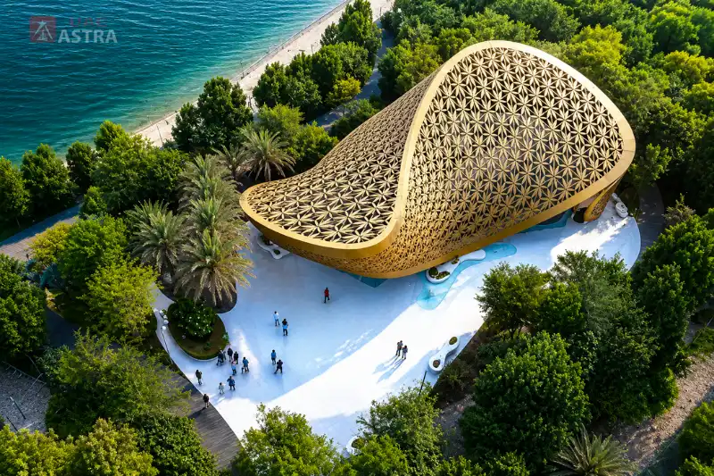 Aerial view of Al Noor Island in Sharjah featuring its iconic Butterfly House and lush waterfront surroundings