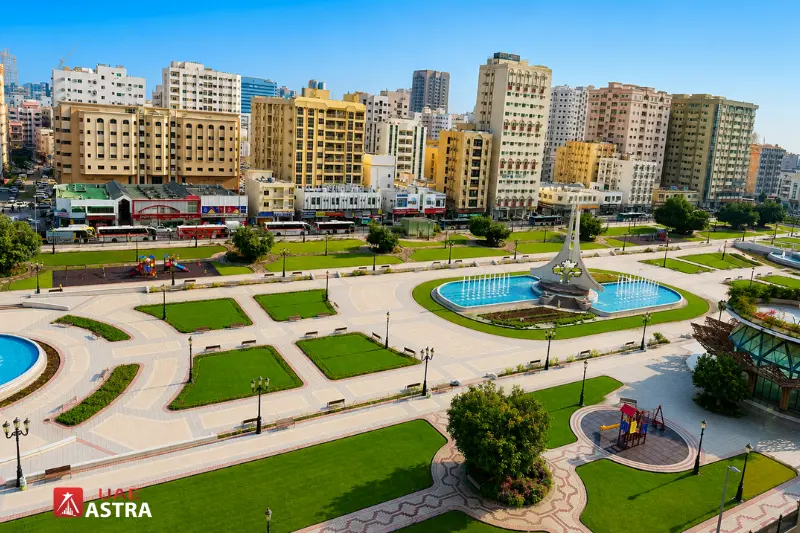 Aerial view of Rolla Square Park with landscaped gardens in Sharjah