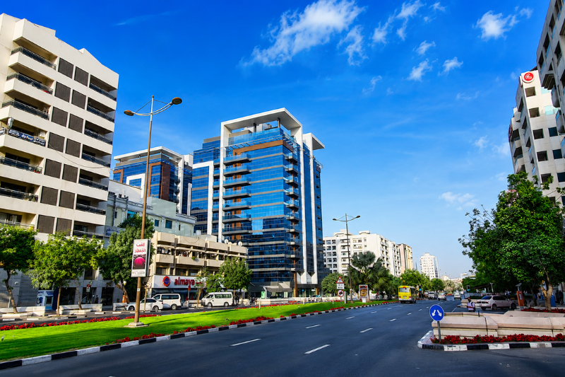 Al Muraqqabat Dubai modern street view with commercial buildings