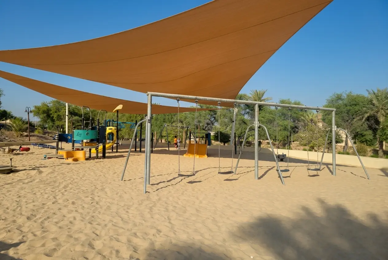Children's playground at Hatta Hill Park with shaded outdoor play area