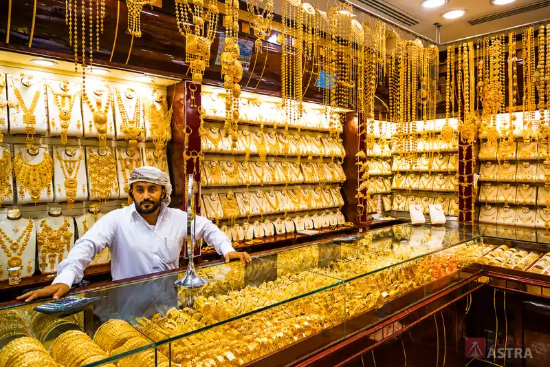 Gold jewellery shop inside Dubai Gold Souk showcasing traditional necklaces, bangles, and bridal collections