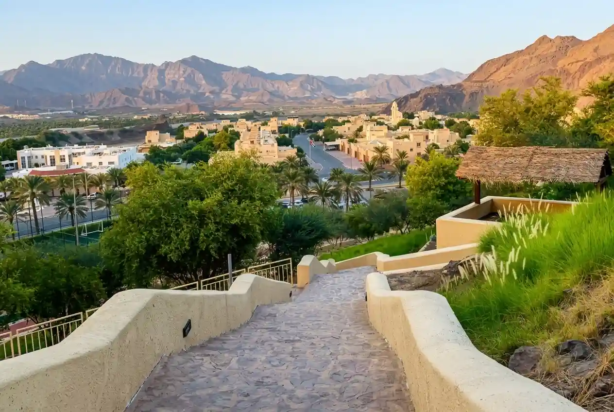 Hilltop pathway at Hatta Hill Park overlooking Hatta town and mountain landscape