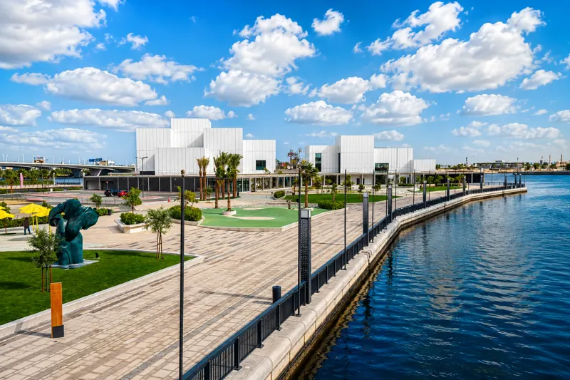Jaddaf Waterfront promenade with modern architecture, landscaped walkways, and scenic views along Dubai Creek