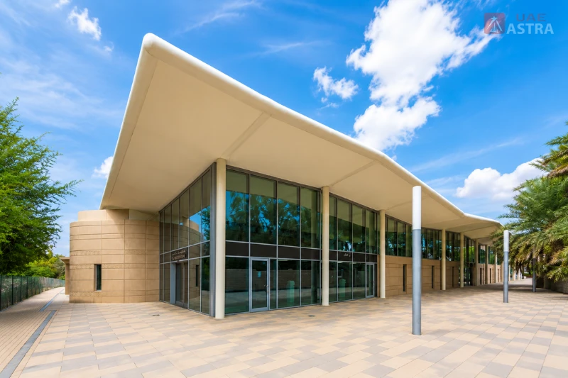 Modern exterior design of Al Ain Bus Station with covered passenger entrance