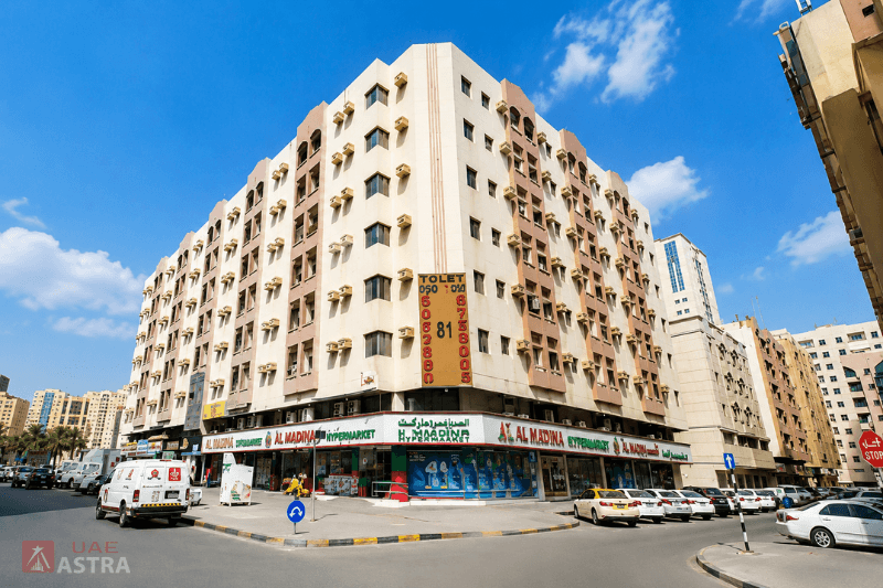 Residential apartment building with supermarket in ground