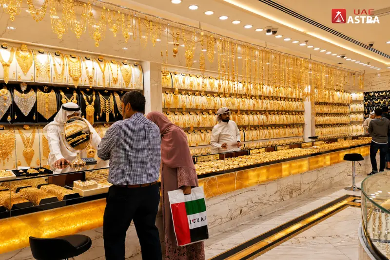 Customers shopping for gold jewellery inside a luxury showroom at Gold and Diamond Park Dubai