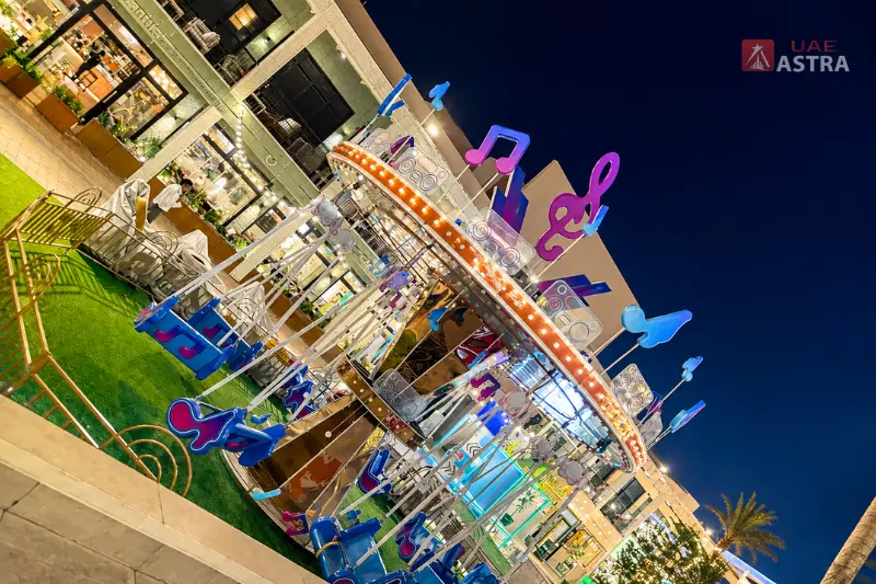 Deerfields Mall outdoor family entertainment area at night