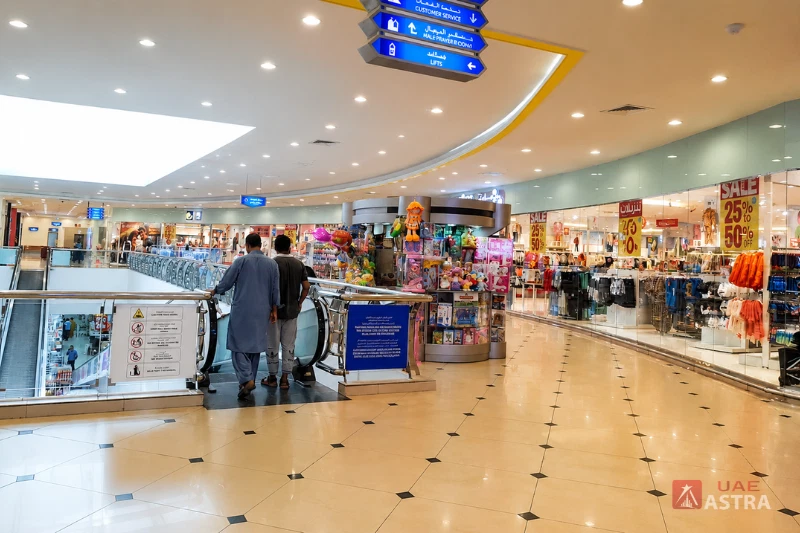 Safeer Mall Ajman interior shopping area with stores and escalator