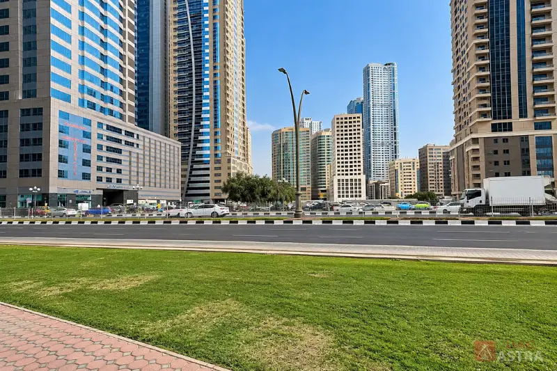 Al Khan streetscape and high-rise buildings near Al Hind Tower in Sharjah