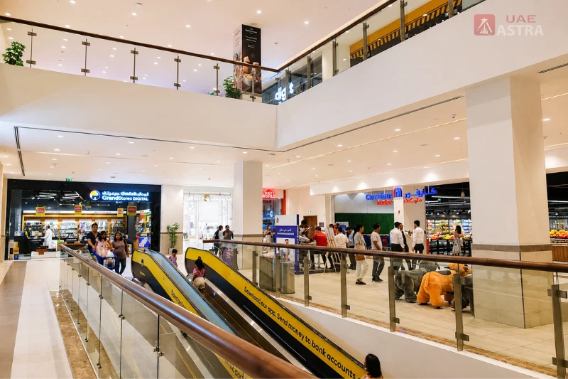 Spacious interior of The Springs Souk with shops and escalators