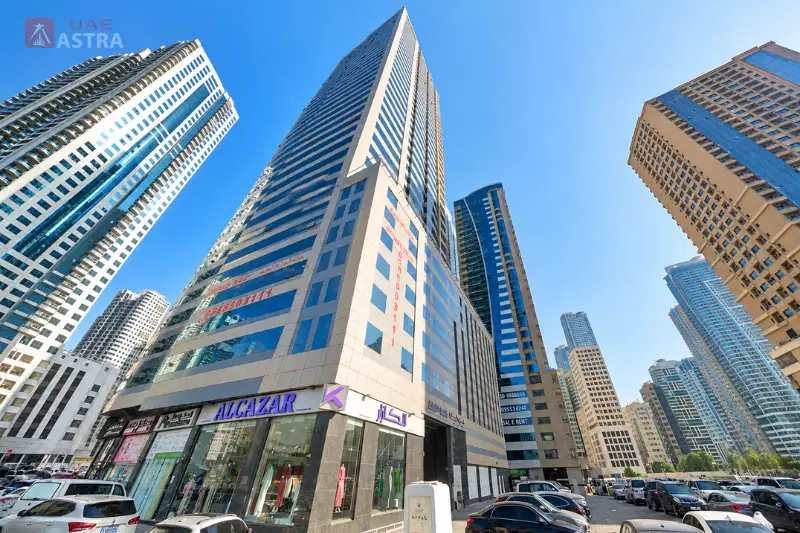 Street-level view of Al Hind Tower and surrounding high-rise buildings in Al Khan, Sharjah
