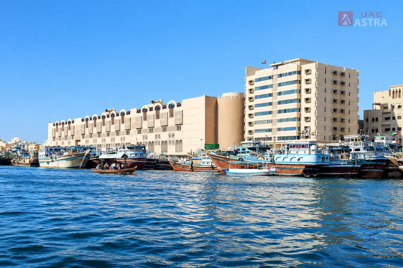 Traditional abra and boats on Dubai Creek near Al Sabkha Marine Station