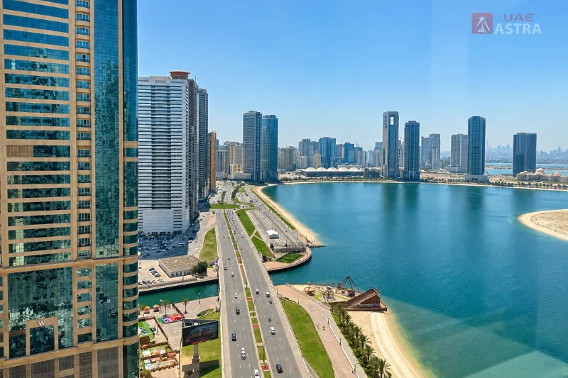 Waterfront view near Al Khan with Sharjah’s skyline and lagoon promenade