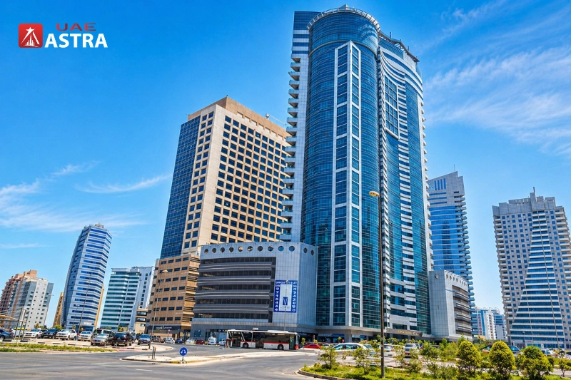 Tameem House office building in Barsha Heights Dubai with surrounding commercial towers and road view
