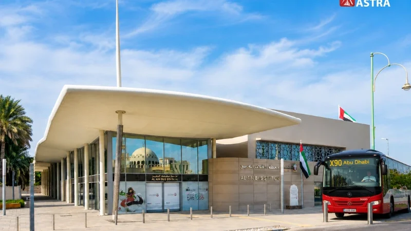 Al Ain Bus Station entrance with an intercity bus ready for passenger service