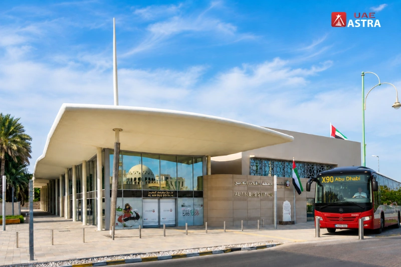 Al Ain Bus Station entrance with an intercity bus ready for passenger service