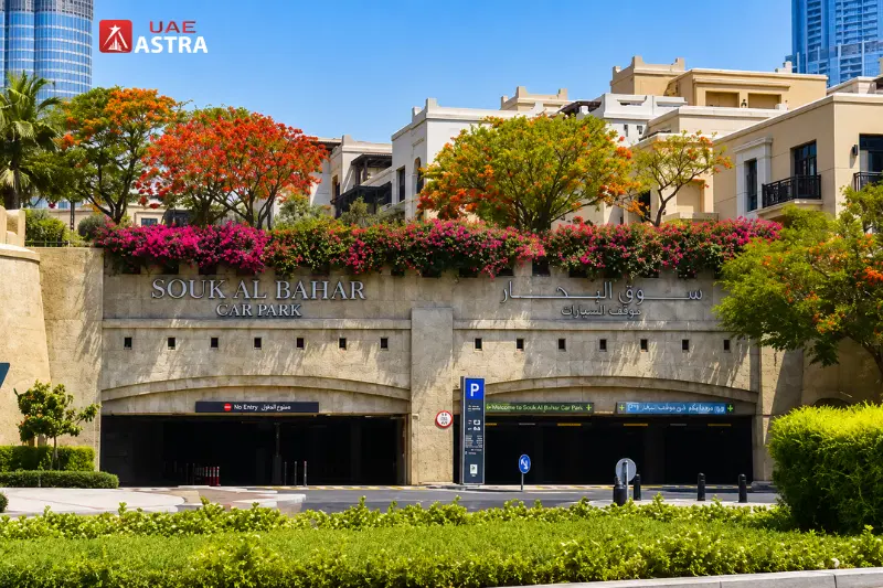 Entrance to Souk Al Bahar underground parking in Downtown Dubai with landscaped surroundings and easy vehicle access