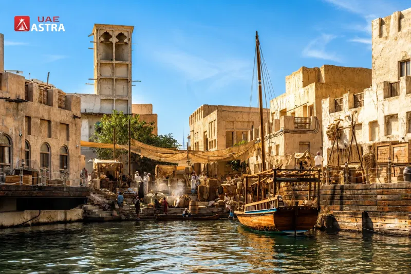 Dubai Old Village heritage waterfront with traditional buildings and boats