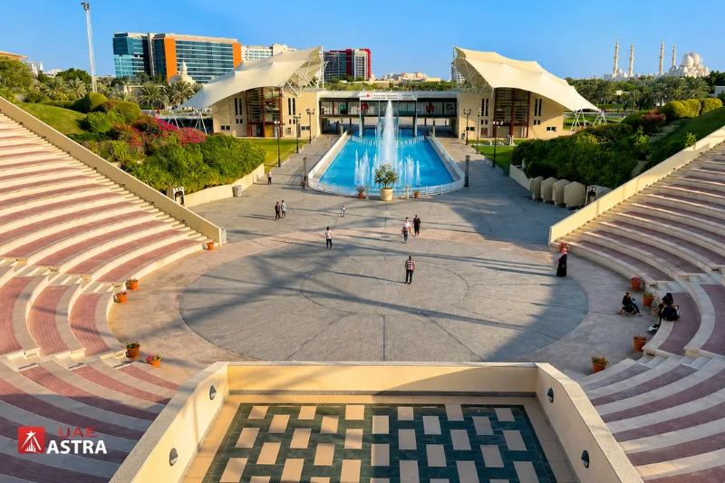 Khalifa Park Abu Dhabi plaza with fountain and gardens