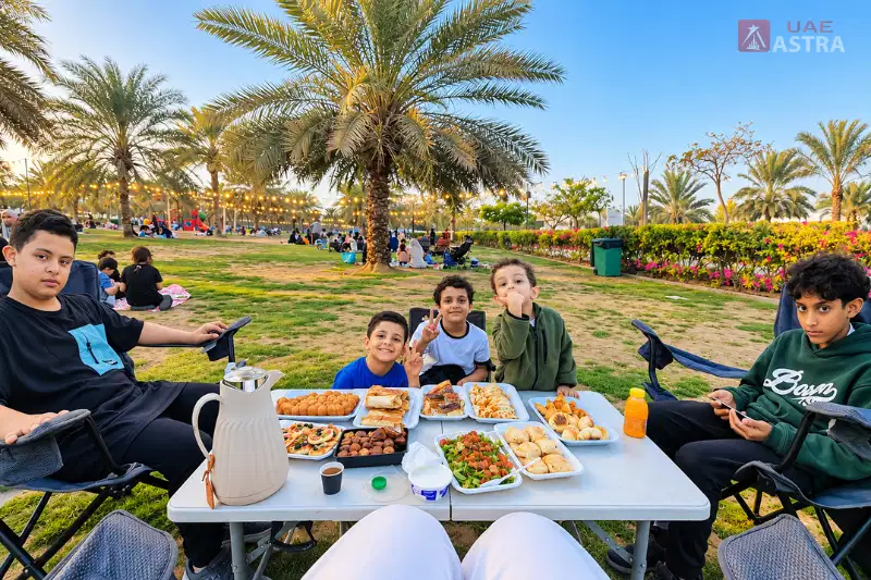 Al Safia Park family picnic area with palm trees and outdoor seating