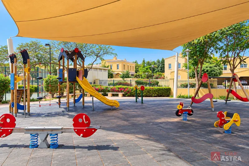 Arabian Ranches Dubai community playground with shaded slides and childrens play equipment