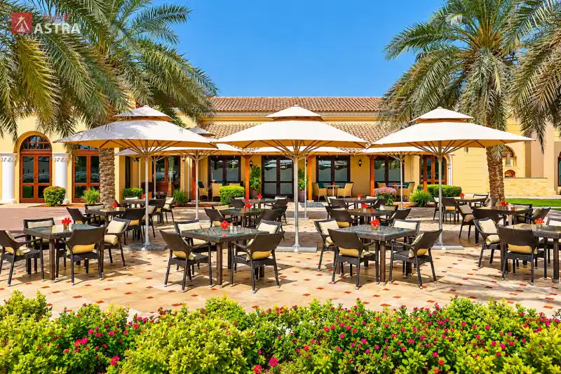 Arabian Ranches Dubai outdoor dining area with shaded seating and landscaped gardens