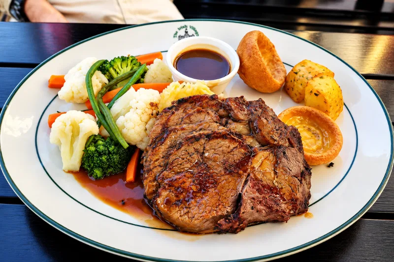 Irish Village Dubai roast beef with vegetables and potatoes
